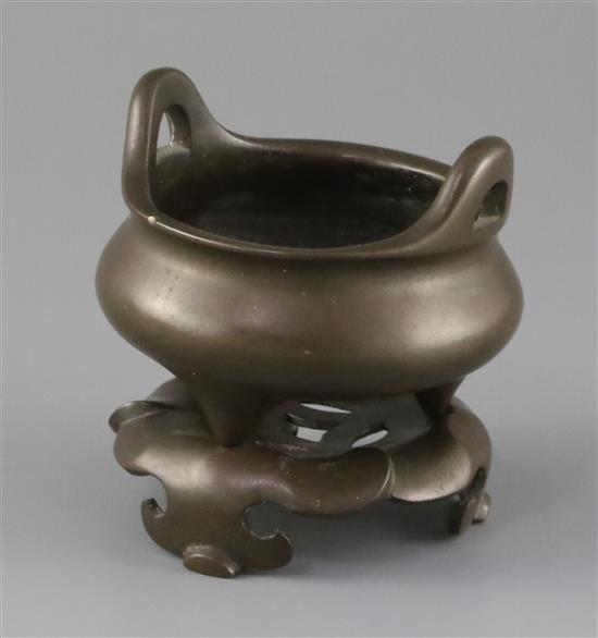 A Chinese bronze tripod censer and stand, Xuande mark but later Qing dynasty, censer 9.5cm diam.